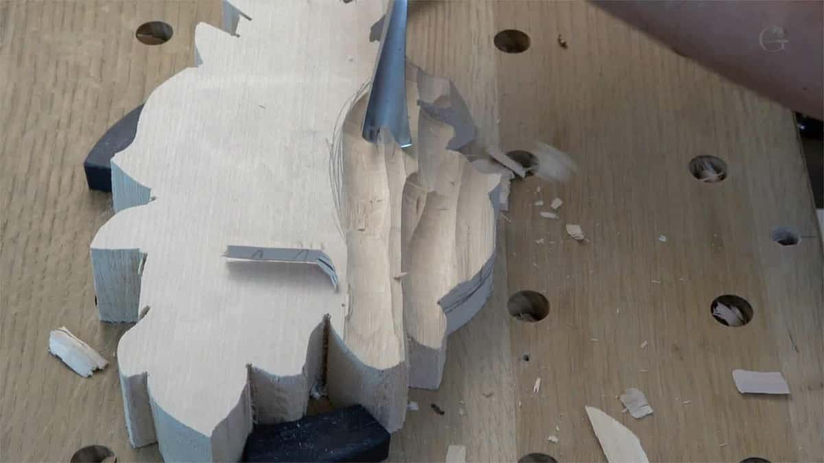 Bandsawn blank waiting on a benchtop, offcuts and a gouge beside it