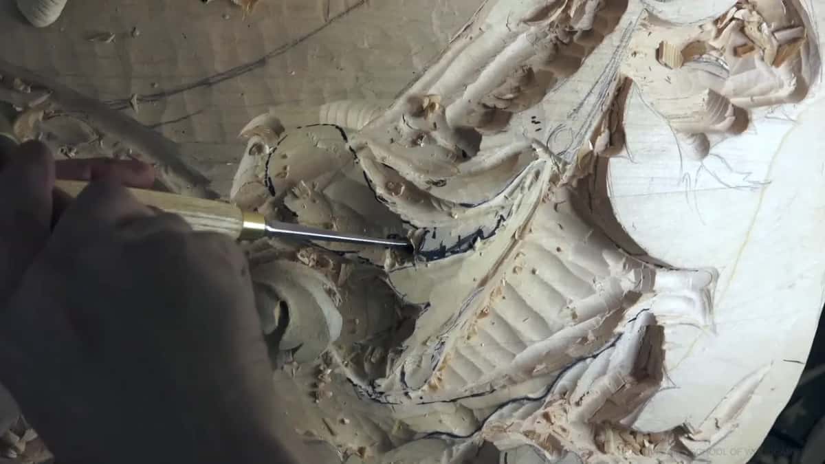 A gouge points into the leaf.