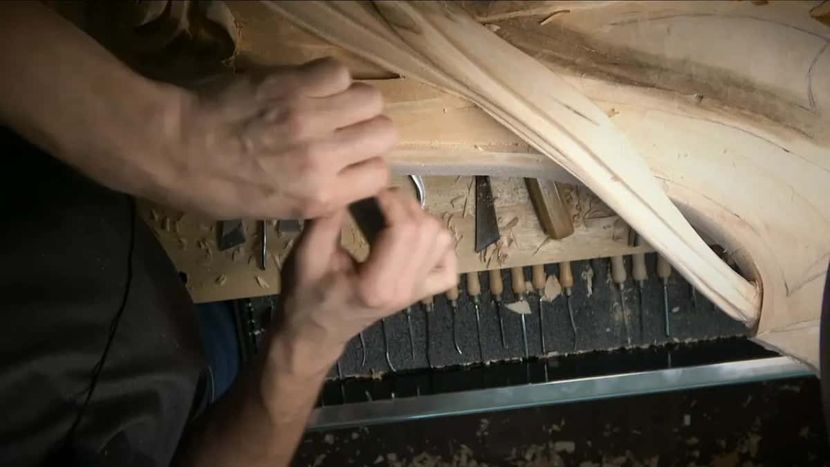 Both hands scrape the band