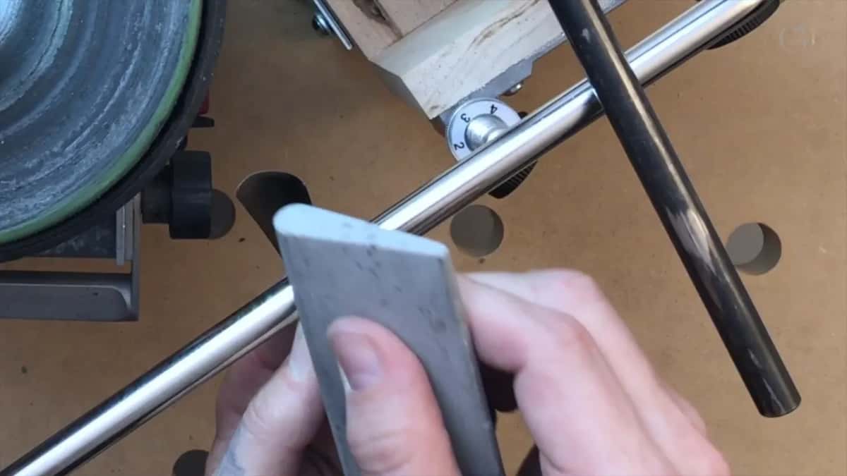 Pale slip stone pushed along the inside sweep.