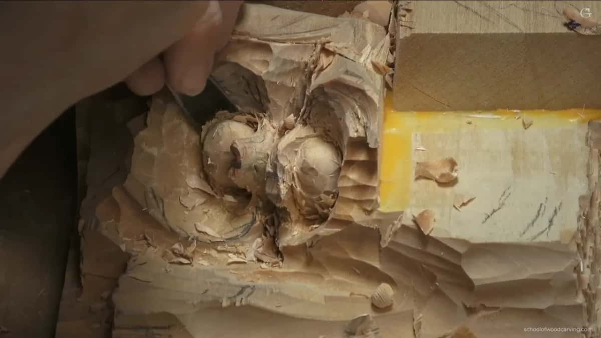From the upper left, a gouge enters above both nuts