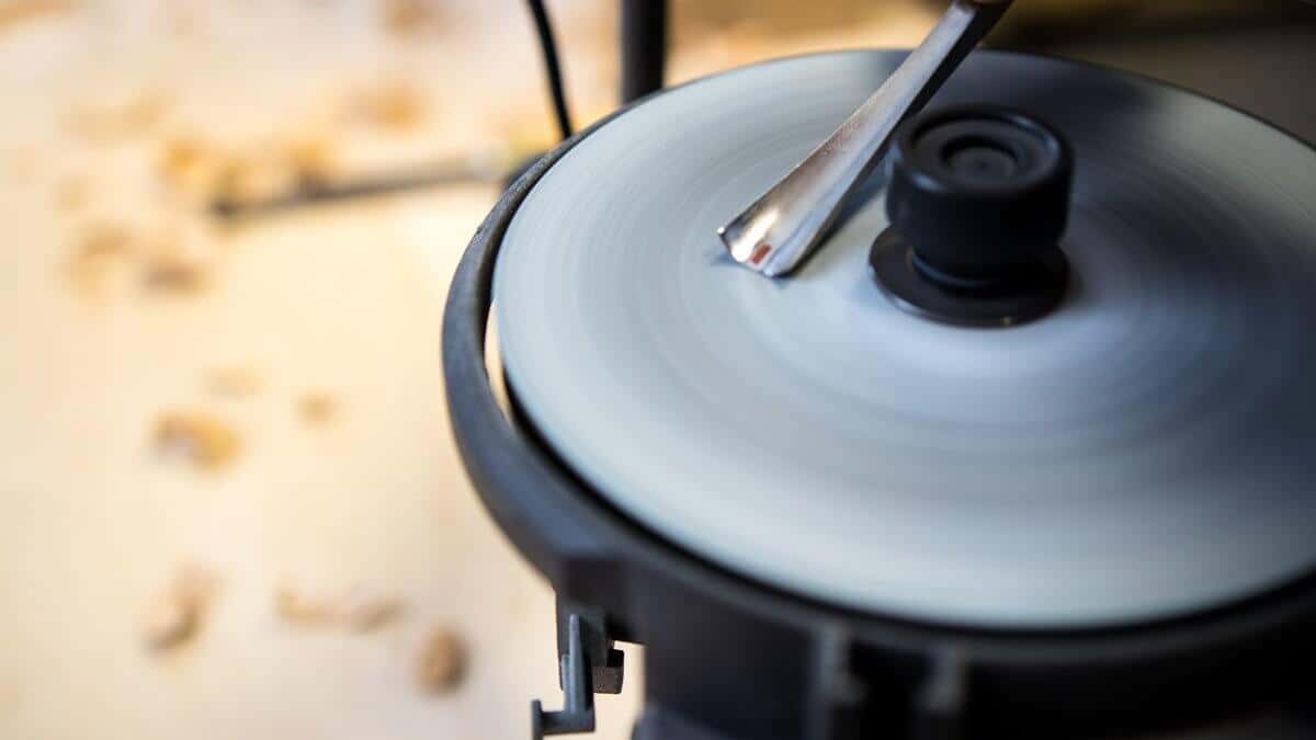 Gouge on the disc Gouge laid across the sharpening disc