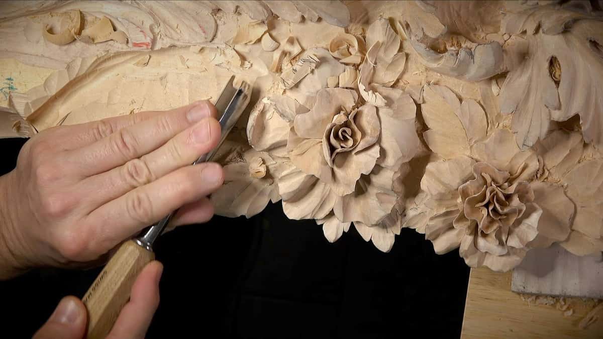 Finished high relief carving showing depth and shadow in limewood