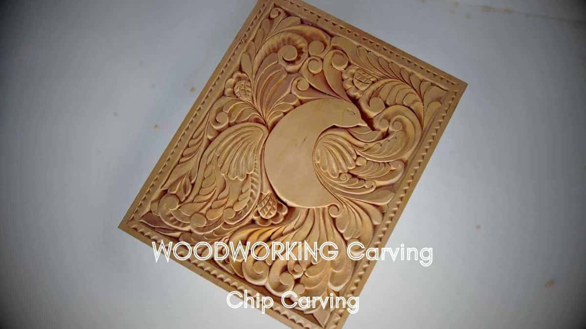 A rectangular basswood panel carved with a bird among scrolling foliage inside a beaded border, seen from above