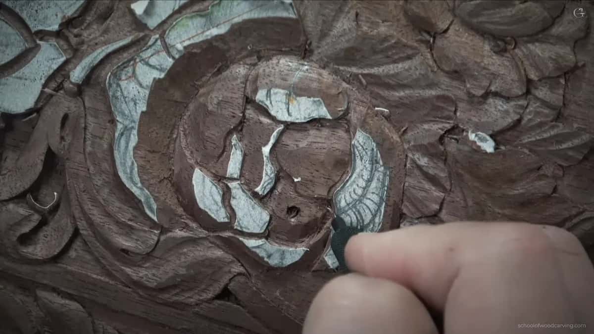 Carved right through the petal Deeply undercut antique panel, one long hollow carved right through a petal