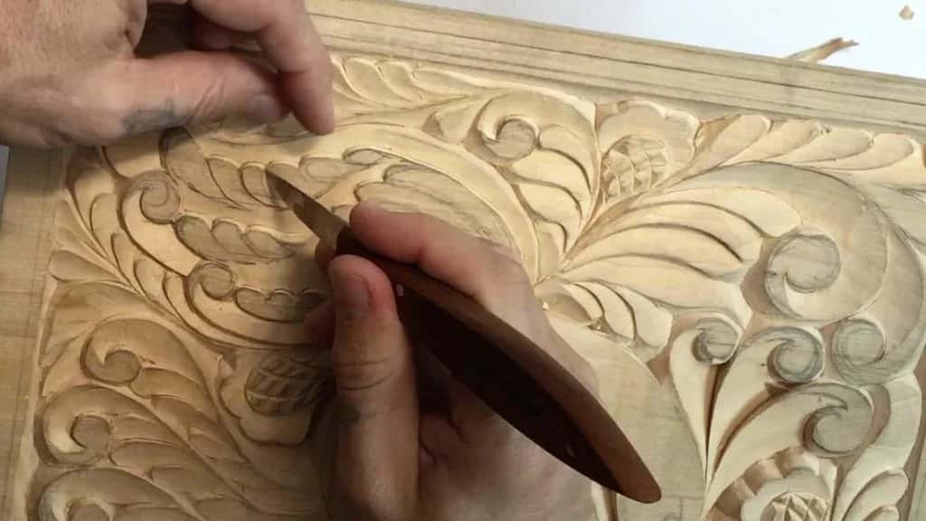 A gouge slicing one curl off the curly board