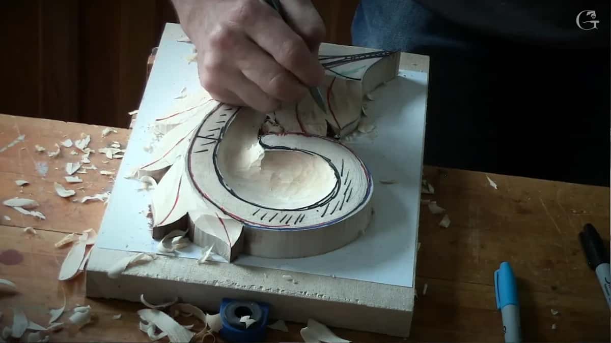 Marking the eye as a water drop Water drop shape pencilled onto a carved leaf where an eye will be sunk, marker lines running around it