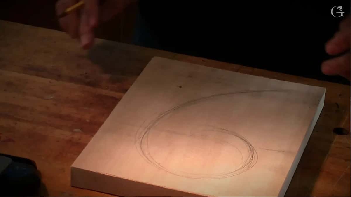 A bare board carrying nothing but one swirl in pencil