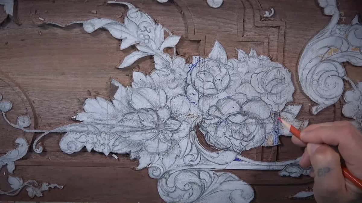 Walnut furniture panel, drawn on one half and carved on the other A walnut panel half carved and half still pencil, a red marker holding the high spots
