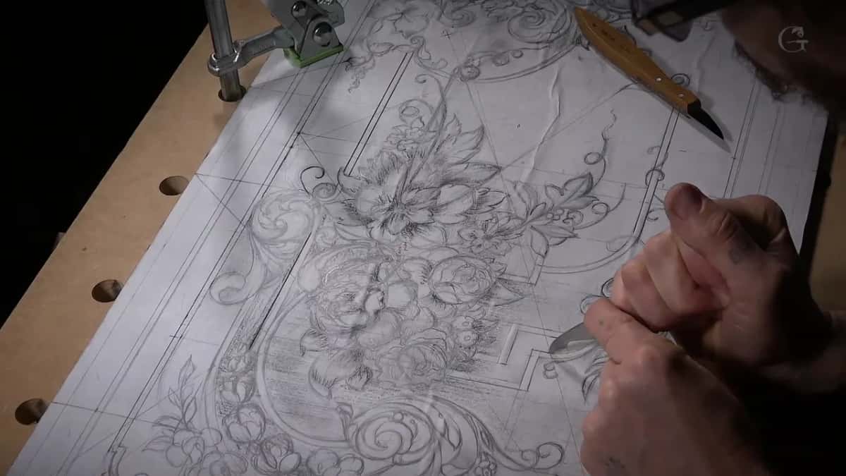 Trimming the paper drawing before it goes onto the wood