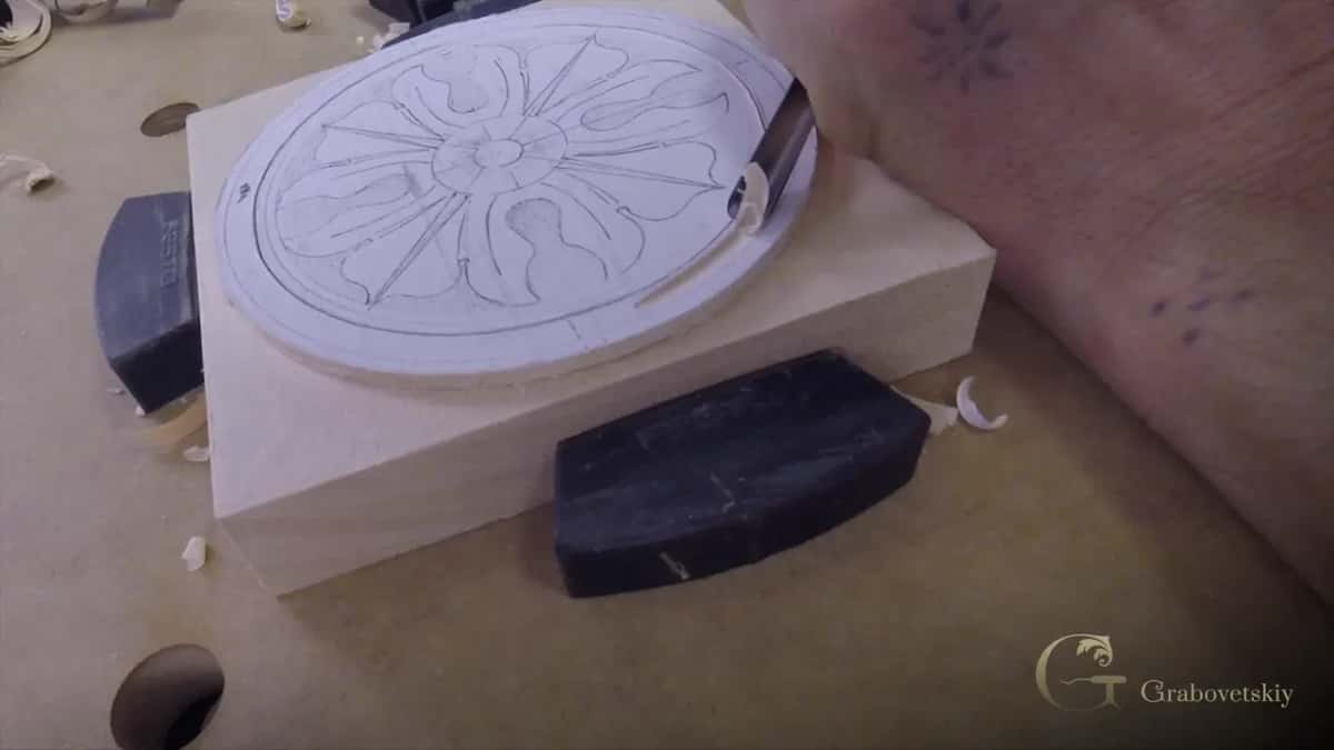 The block clamped between two holdfasts with the paper drawing still stuck to its face