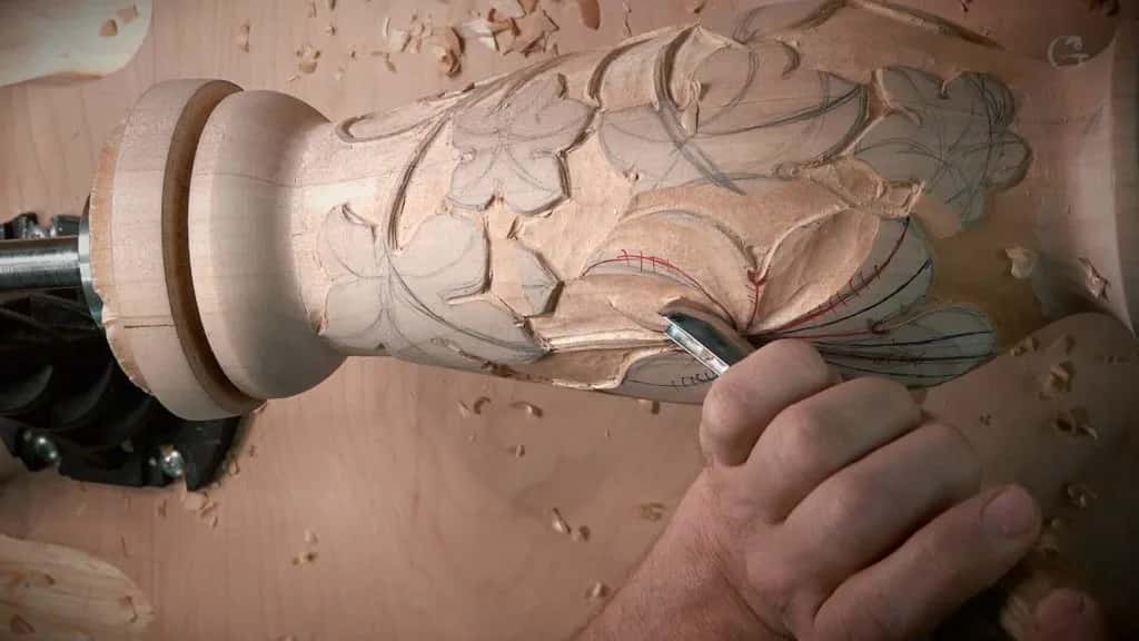 Grape leaves being carved around a turned column