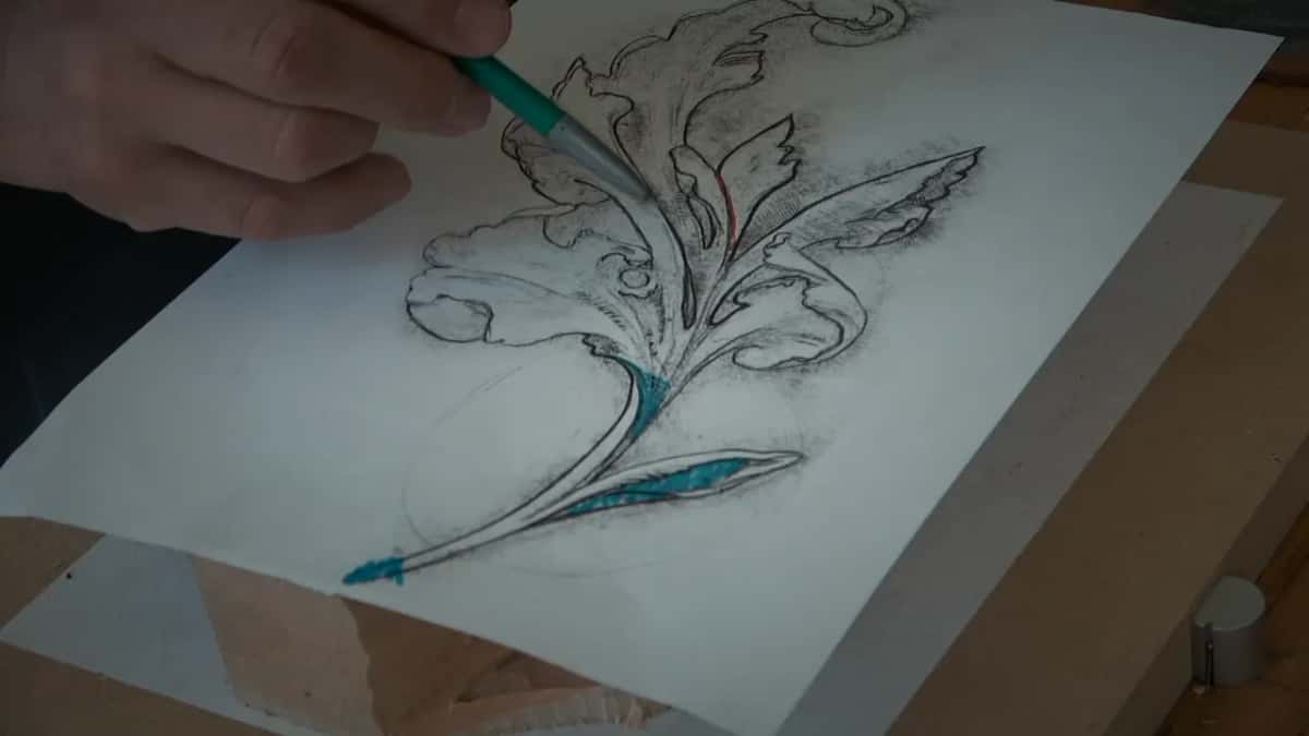 Design drawing for the leaf Charcoal acanthus drawn on white paper with teal marker laid into the lobes that will drop away