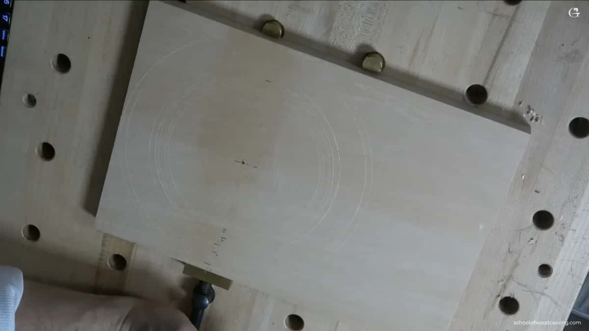 Rings around the board, with every border measurement pencilled at the edge so you can read them off the wood instead of guessing from my mouth