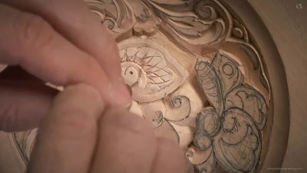 One dark dot in the middle of a carved eye, lifted out with a twist