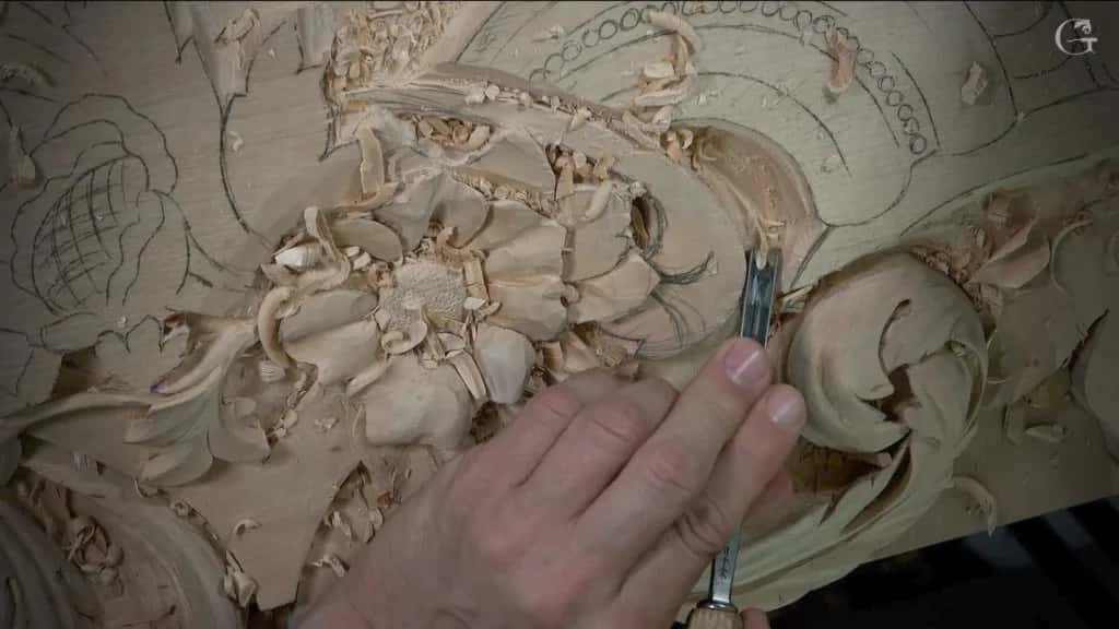Carving the flower cluster, one petal at a time, on the Venice room panel where the light falls hardest