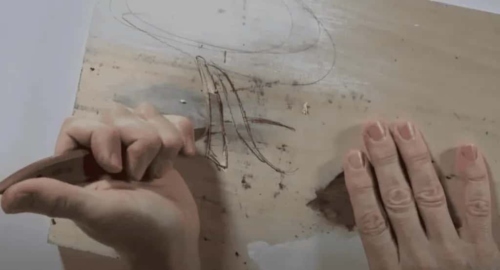 Drawing the pattern onto the board before anything is carved, where most panels are won or lost