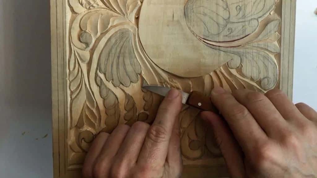 Early relief work on the curly board, the ground already down and the shapes waiting to be modelled