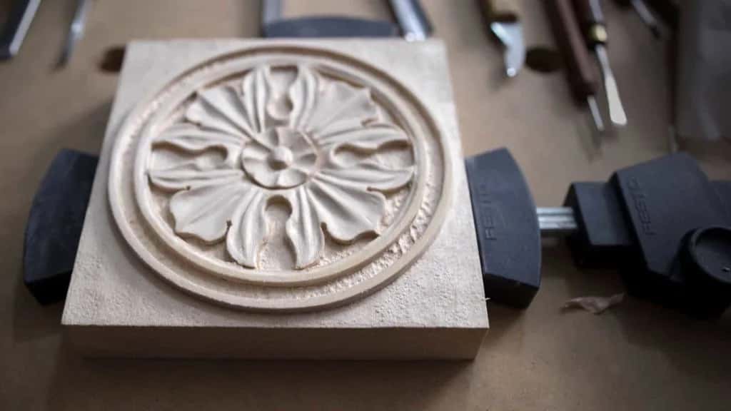 The antique rosette finished, still on its block