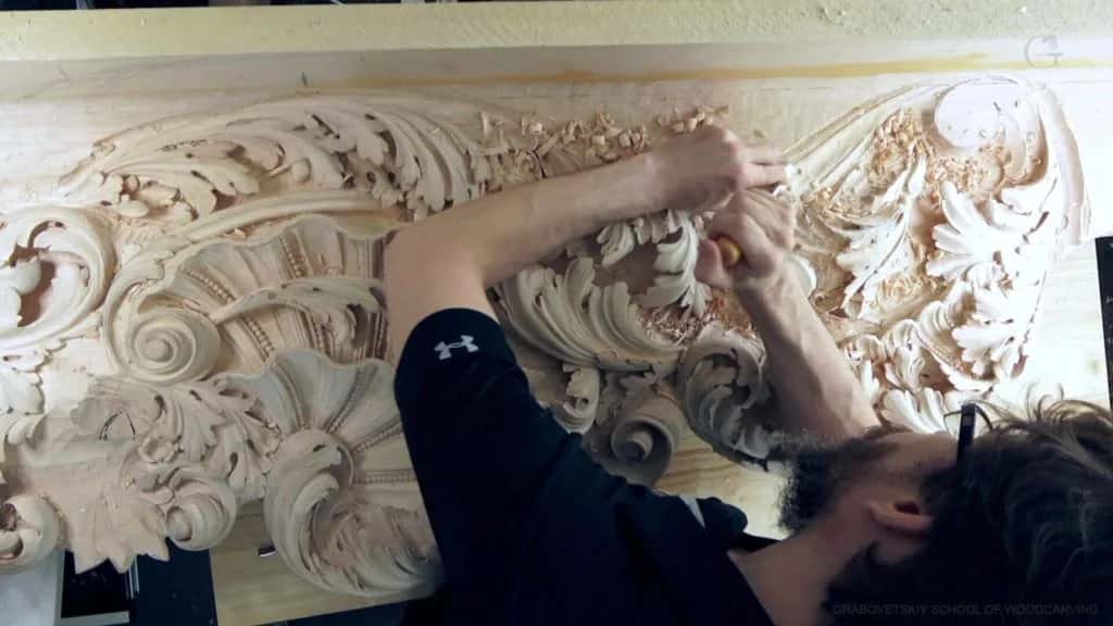 Both hands in the scrollwork