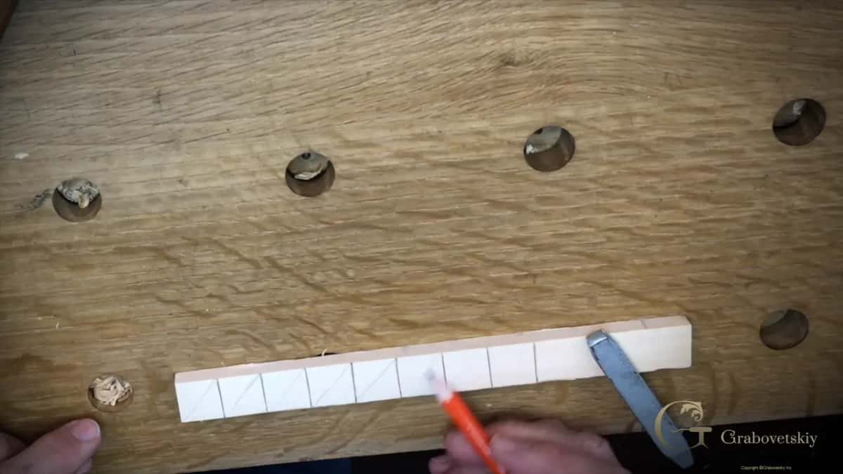 Pencil diagonals drawn corner to corner inside every space of the molding strip