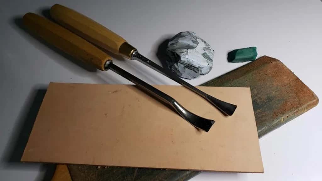 A leather strop, a block of compound and two gouges, which is the whole sharpening kit
