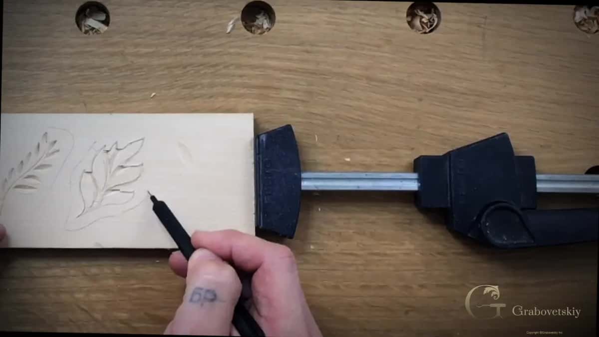 Outline drawn about 5mm around a carved leaf, the line the angled passes travel toward