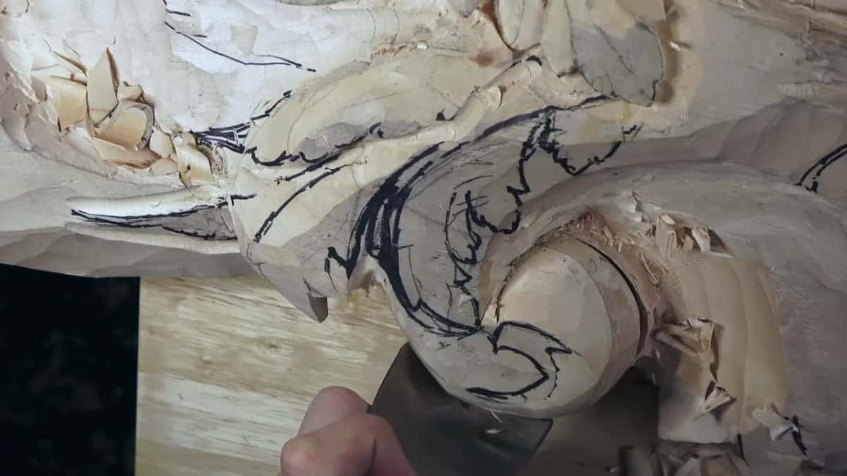 Thumb on its steel, the gouge rests inside the curve.