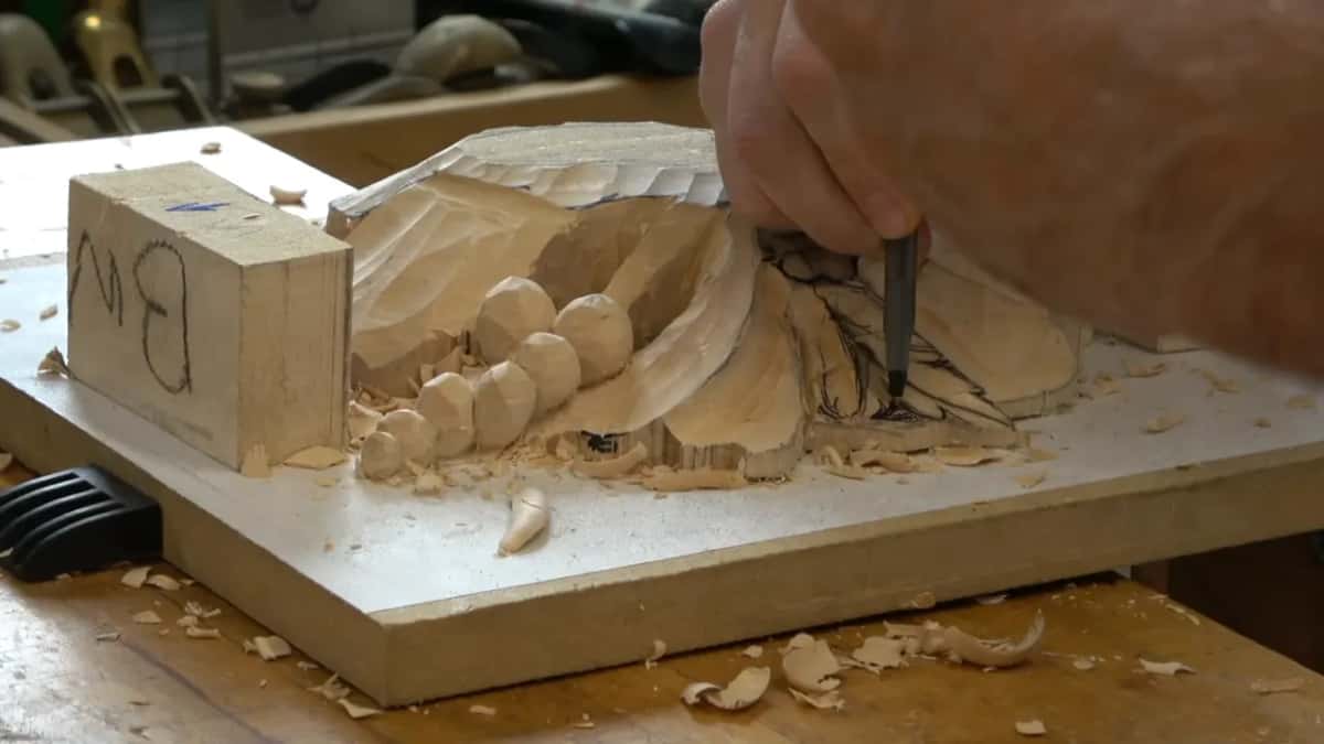 Chisel laid into the corner where two sections come together, waste still standing in the angle