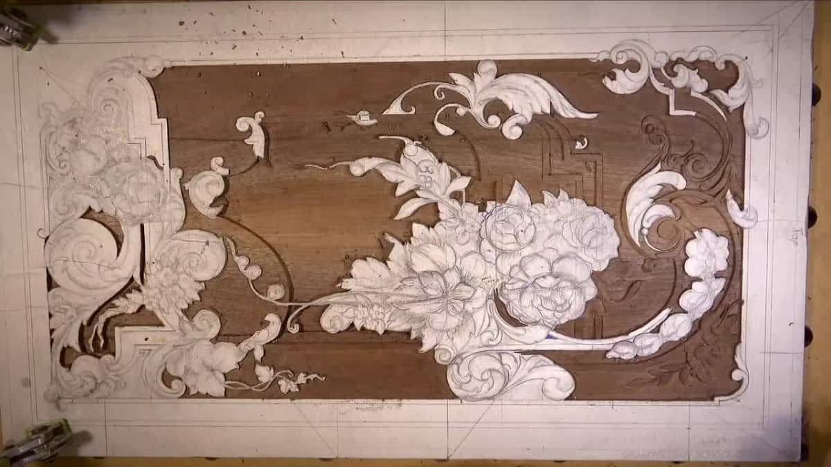 Whole panel photographed straight down from above, its pattern of leaves and flowers readable at last