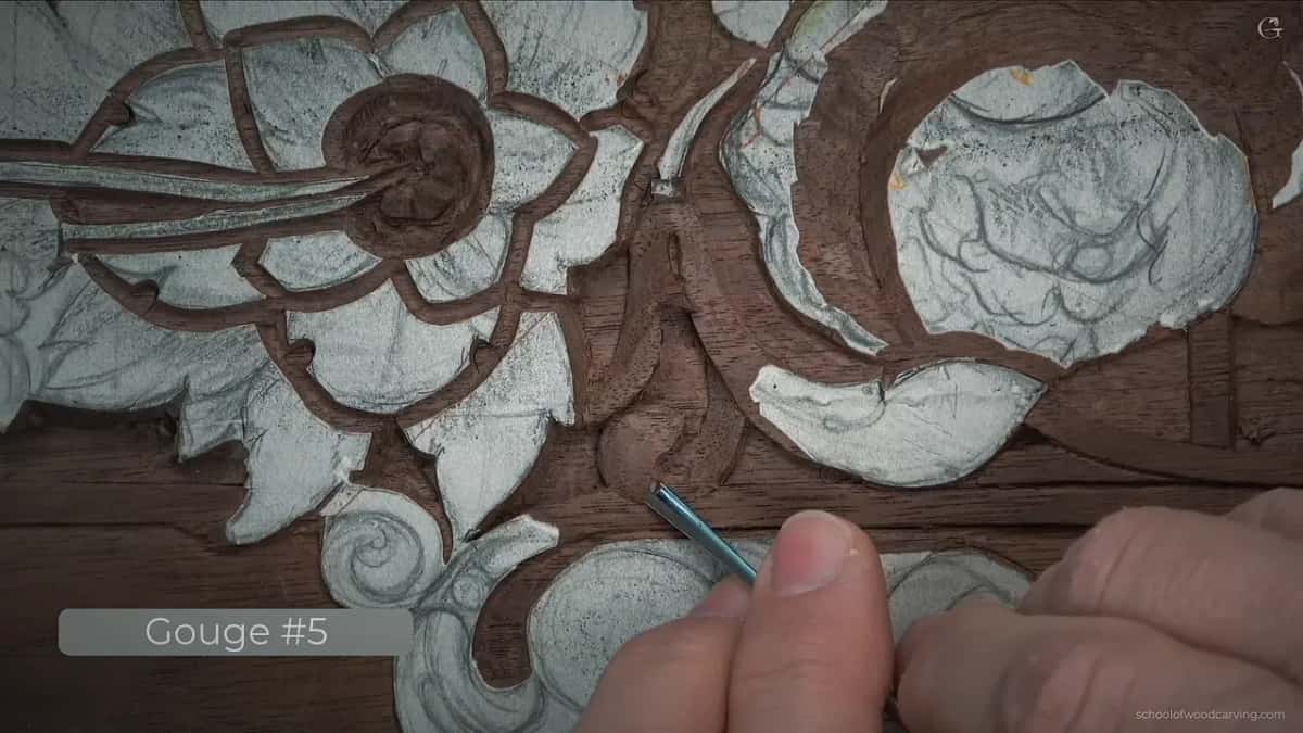 Fingers hold the gouge low against the leaf while the video label reads Gouge 5.