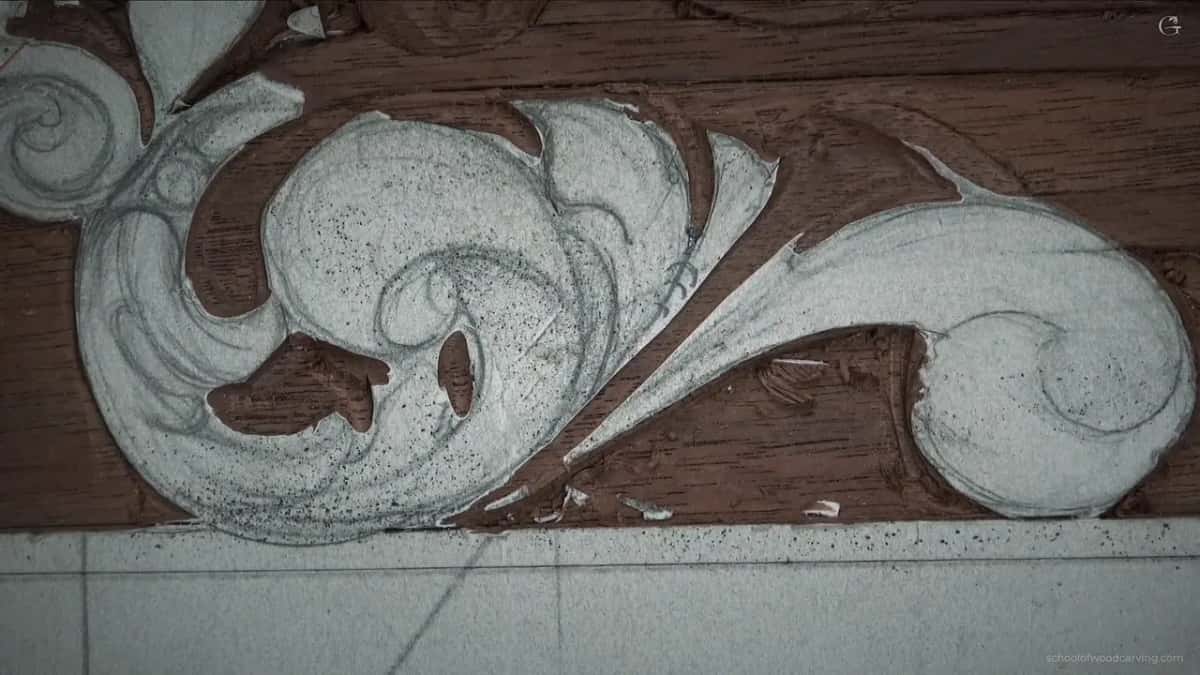 Nothing but carving in this one, the scroll turning away into its own shadow.