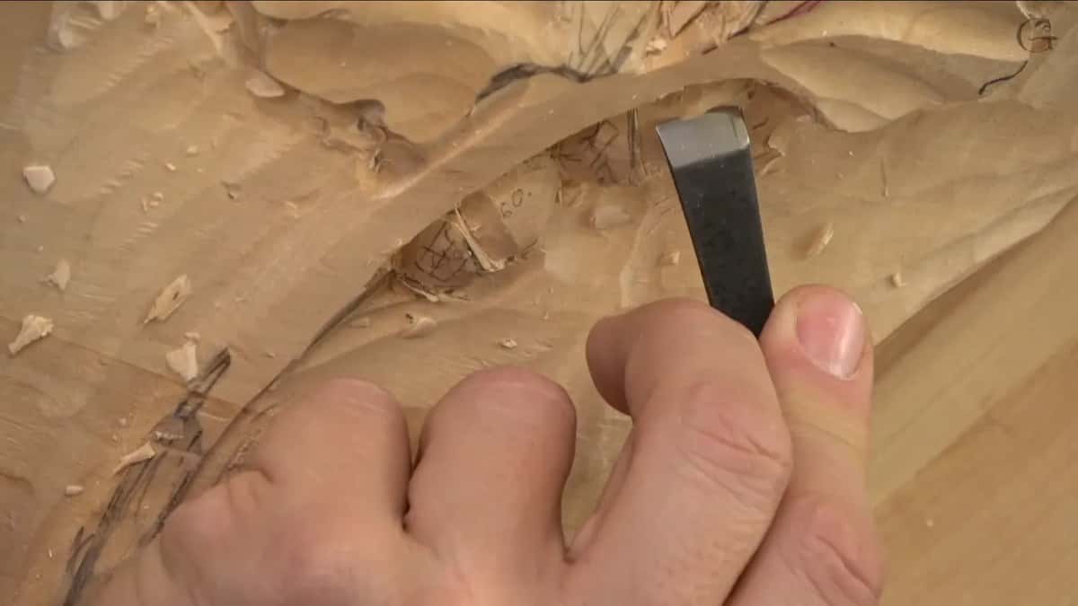 Upright flat tool beside the acorn with the pencil 60