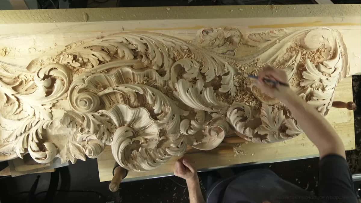 Pencil in his right hand above the half carved end, working out where the next leaf will go.