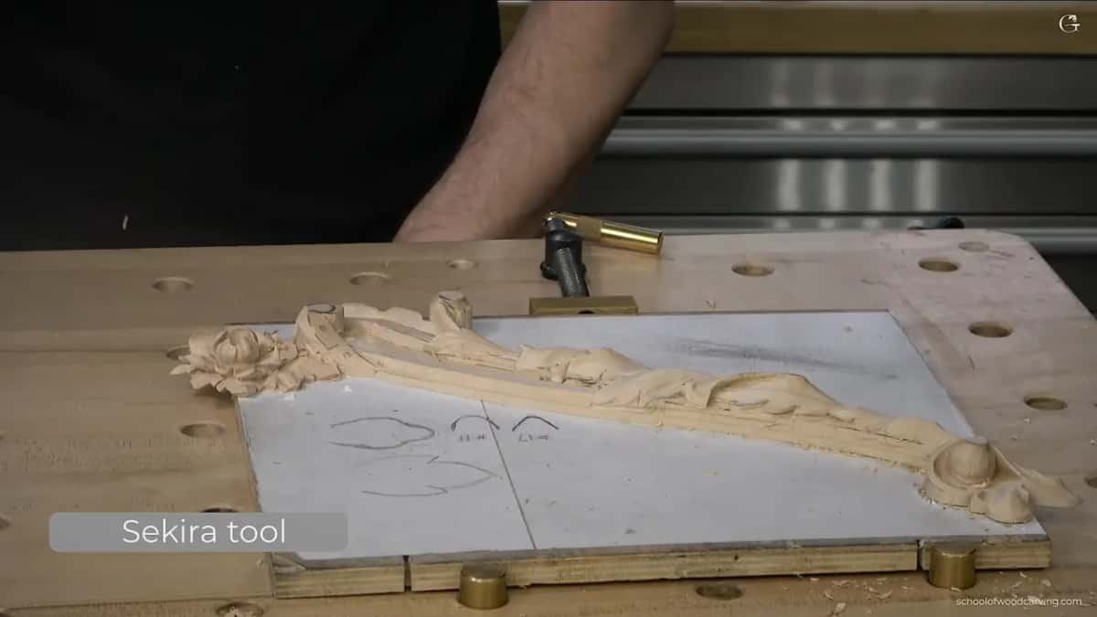 Whole panel from above with the acanthus running its length and the molding ground still rough.