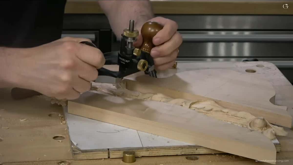 Plane riding on a pair of offcuts, because this panel has no flat surface left on it.