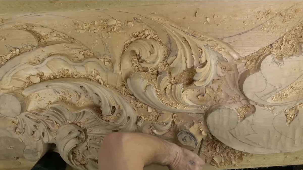 Bare forearm over the scroll.