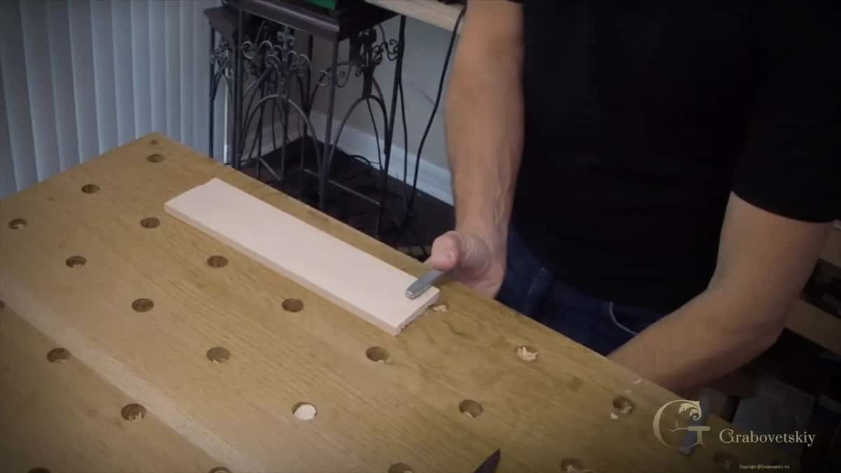 Board clamped flat to the bench