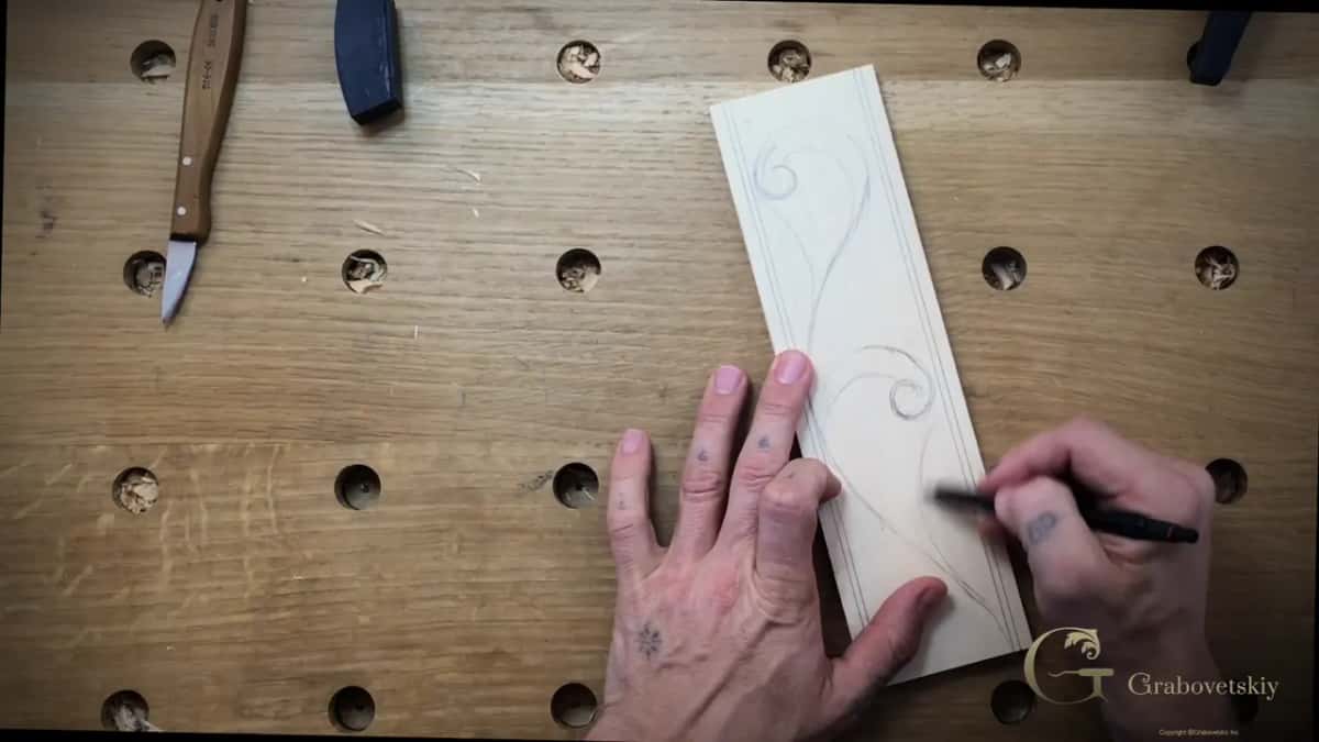 Design growing across the board, a second swirl going in beside the first