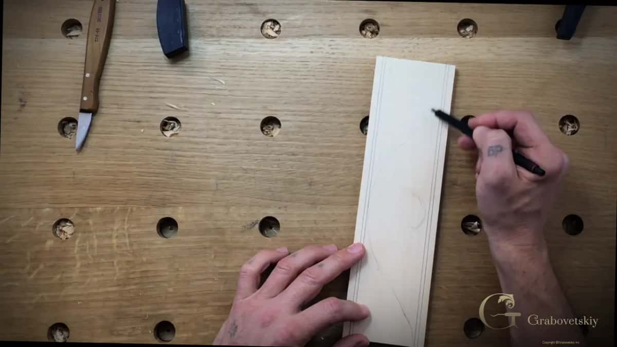 Marker putting the first swirl on the wood