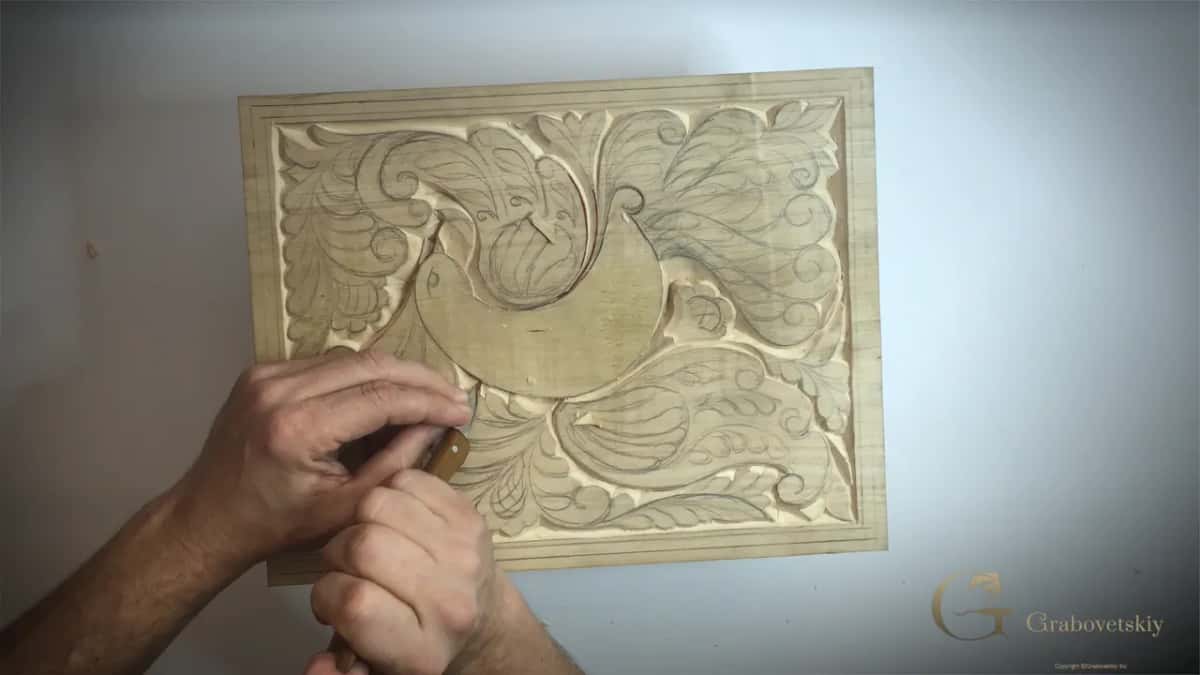 Shadow across the finished area, which is the only way a carving in one colour shows depth.