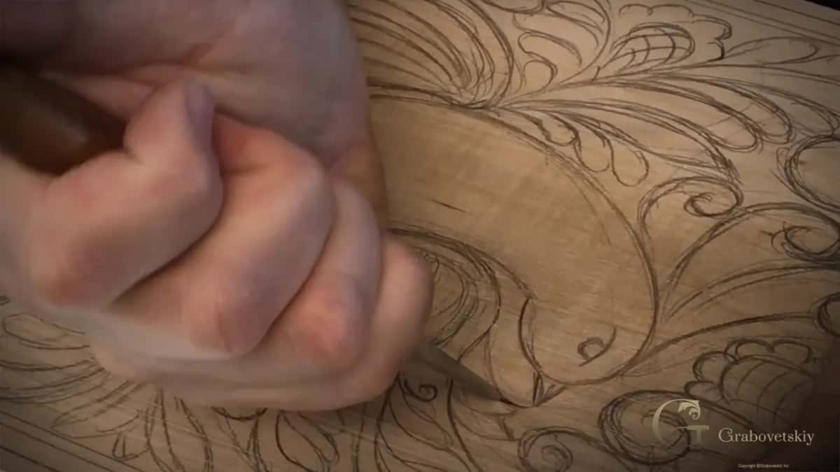 The point resting exactly on the pencil line.