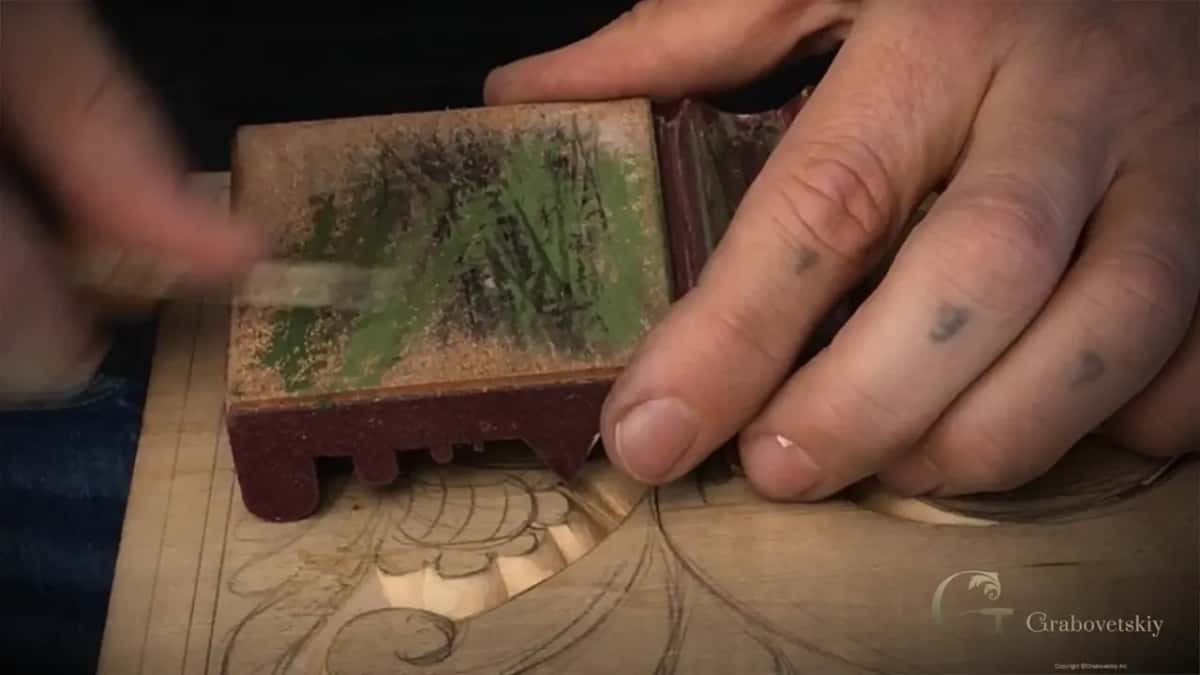 Green compound rubbed into a leather strop block.