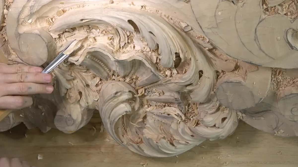 A bent shank reaches deep into the hollow below the big scroll.