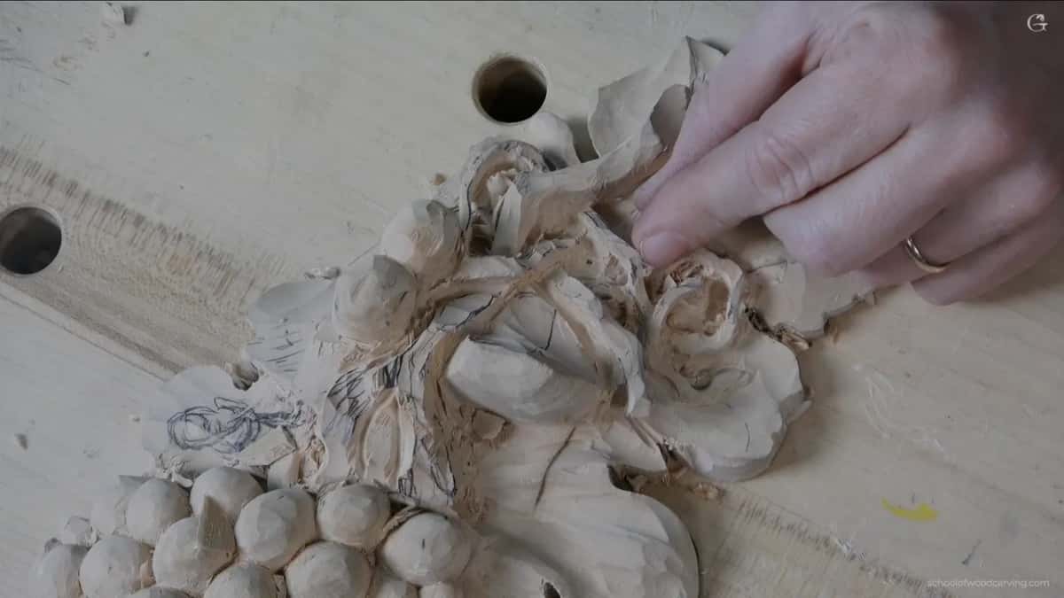 Fingertip against the thinned area, testing how much it gives