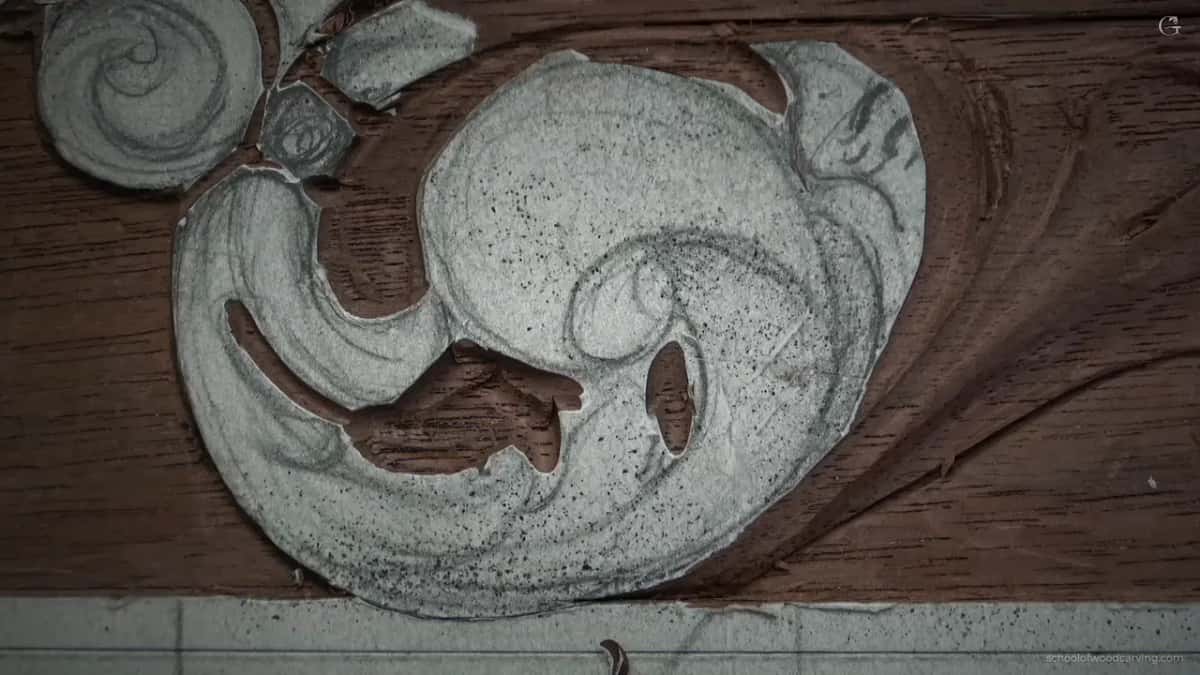 Carved leaf alone in frame, chalk still on its raised surfaces.