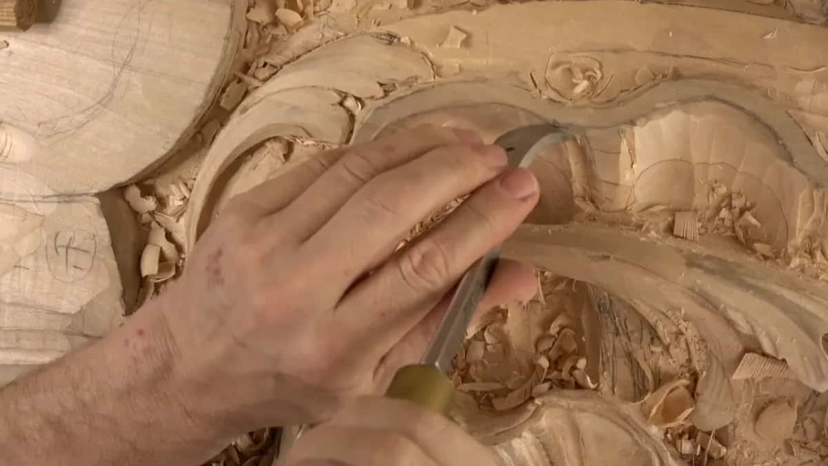 Brass ferrule and gouge digging down into the shell, chips all around.