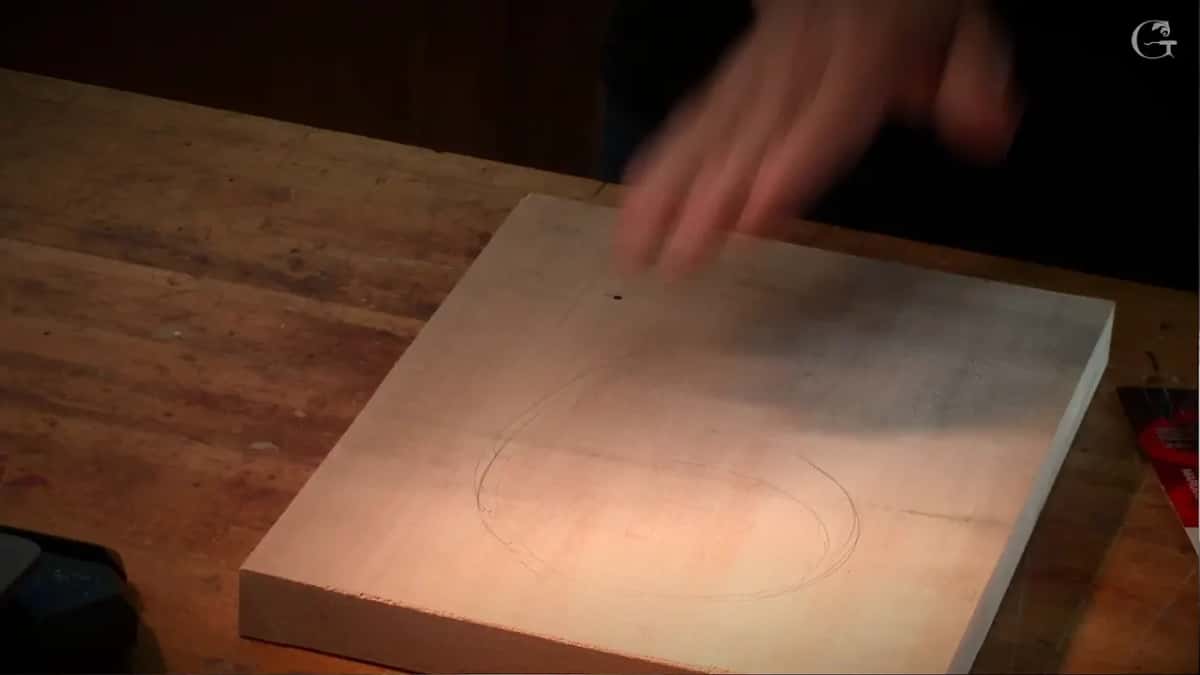 Caught mid gesture above the drawn board