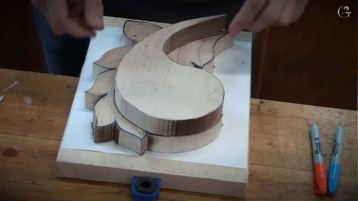 Upper layer set on the lower one, a hand at its edge