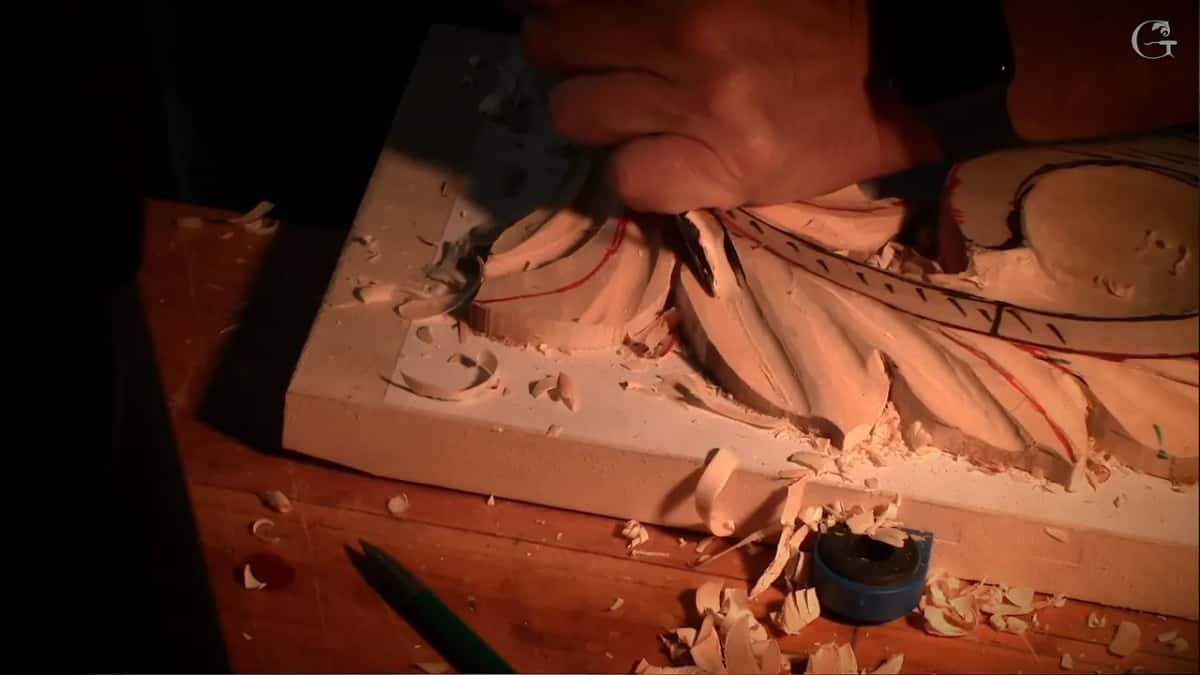 Cleaning back through a cut already made, both hands on the nine